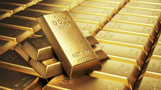 الذهب يتراجع مع صعود الدولار بعد خفض الفائدة الأميركية